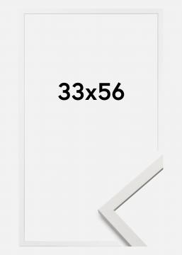 Edsbyn Hvit er en tynn stilren hvit ramme i tre, perfekt til bildeveggen. Laget i Sverige. Størrelse 33x56 cm